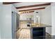 Spacious kitchen featuring stainless steel appliances, granite countertops, and tile floors at 5229 Milford Rd, Charlotte, NC 28210