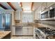 Updated kitchen featuring stainless steel appliances, granite countertops, and a gas range at 5229 Milford Rd, Charlotte, NC 28210