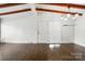 Bright living room with hardwood floors, wood beam ceiling, and ample natural light at 5229 Milford Rd, Charlotte, NC 28210