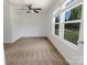 Bright bedroom with soft carpet, a ceiling fan, and plenty of natural light from large windows at 556 Big Lick Rd, Stanfield, NC 28163