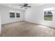 This empty bedroom offers carpet, bright natural light and simple finishes at 556 Big Lick Rd, Stanfield, NC 28163