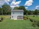 Aerial view of a home with a covered patio and fenced backyard at 556 Big Lick Rd, Stanfield, NC 28163