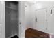 Bright entryway featuring hardwood floors, a coat closet, and a white front door at 556 Big Lick Rd, Stanfield, NC 28163