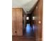 Hallway with wood paneling and hardwood floors leading to other rooms at 5881 Robinhood Rd, Fort Lawn, SC 29714
