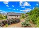 A view of the landscape in the backyard with manicured shrubs and trees at 6107 Gold Springs Way, Denver, NC 28037
