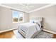Serene bedroom with a large window, hardwood floors, a comfortable bed, and modern decor at 6107 Gold Springs Way, Denver, NC 28037