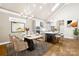 Bright dining area with modern chandelier, vaulted ceilings, and seamless access to kitchen at 6107 Gold Springs Way, Denver, NC 28037