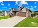 Attractive home with stone details, well-kept lawn, and a convenient two-car garage at 6107 Gold Springs Way, Denver, NC 28037