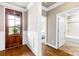 Inviting foyer with hardwood floors, a decorative front door, and neutral wall colors at 6107 Gold Springs Way, Denver, NC 28037