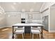Elegant kitchen with stainless steel appliances, island seating, and sleek white cabinetry at 6107 Gold Springs Way, Denver, NC 28037