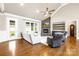 Bright living room featuring a stone fireplace, ample natural light, and an open layout for entertaining guests at 6107 Gold Springs Way, Denver, NC 28037
