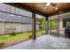 Screened-in patio with outdoor view of backyard and wood ceiling with ceiling fan at 6107 Gold Springs Way, Denver, NC 28037