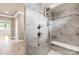 Walk-in shower features beautiful tile work with a built-in bench and dual shower heads at 6107 Gold Springs Way, Denver, NC 28037