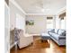 Comfortable sitting room with hardwood floors, neutral paint, a television, and natural light from the window at 6107 Gold Springs Way, Denver, NC 28037