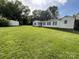 Spacious backyard with lush green grass and a white shed, perfect for outdoor activities and storage at 621 N Craige St # 25 & 27, Salisbury, NC 28144