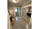 Bathroom featuring neutral gray paint, tile floors, and a mirrored closet, complemented by white fixtures and trim at 621 N Craige St # 25 & 27, Salisbury, NC 28144