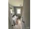 Cozy bathroom featuring a white vanity, toilet, and tub/shower combination, accented with neutral tile and decor at 621 N Craige St # 25 & 27, Salisbury, NC 28144