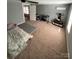 Bedroom featuring neutral carpet and paint, a ceiling fan, and a black and white rug near a bed at 621 N Craige St # 25 & 27, Salisbury, NC 28144