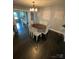 Dining room with hardwood floors and decorative wall art, creating an elegant and inviting atmosphere for meals at 621 N Craige St # 25 & 27, Salisbury, NC 28144