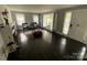 Living room with fireplace, large windows and hardwood floors, offering a comfortable and welcoming space at 621 N Craige St # 25 & 27, Salisbury, NC 28144