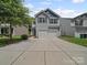 Charming two-story home with a two car garage and concrete driveway at 6803 Ware Rd, Charlotte, NC 28212