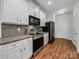 Well-equipped kitchen featuring granite countertops and stainless steel appliances at 6803 Ware Rd, Charlotte, NC 28212