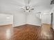 Spacious living room featuring hardwood floors and staircase to second floor at 6803 Ware Rd, Charlotte, NC 28212