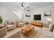 Cozy living room with comfortable seating, fan and media center at 6803 Ware Rd, Charlotte, NC 28212