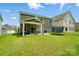 Spacious backyard with a covered patio, perfect for outdoor entertaining at 812 Dogwood Creek Ln, Indian Trail, NC 28079