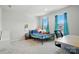 Bright bedroom with blue curtains, a decorative bed frame, and a desk for homework at 812 Dogwood Creek Ln, Indian Trail, NC 28079