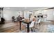 Open dining area showcasing an eating area and seamlessly flowing into the living room and modern kitchen at 812 Dogwood Creek Ln, Indian Trail, NC 28079