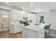 Bright kitchen featuring a large island with seating and sleek stainless steel appliances at 812 Dogwood Creek Ln, Indian Trail, NC 28079