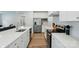 Modern kitchen with stainless steel appliances, white cabinetry, and a spacious countertop at 812 Dogwood Creek Ln, Indian Trail, NC 28079