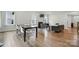 Open-concept floor plan featuring dining area, living room with fireplace, and hardwood flooring throughout at 812 Dogwood Creek Ln, Indian Trail, NC 28079