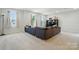 Open and bright living room with a comfortable sofa, television, and large windows at 812 Dogwood Creek Ln, Indian Trail, NC 28079
