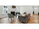 Inviting living room with a fireplace, comfortable seating, natural light and wood floors throughout at 812 Dogwood Creek Ln, Indian Trail, NC 28079