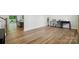 Open living space with hardwood floors, a comfortable seating area, and a well-lit workspace at 812 Dogwood Creek Ln, Indian Trail, NC 28079