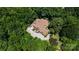 An aerial view highlights the home's surrounding mature trees and patio with lounge seating at 849 Savile Ln, Fort Mill, SC 29715