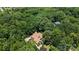 An aerial shot captures the property, its surrounding trees, and patio with lounge seating at 849 Savile Ln, Fort Mill, SC 29715