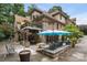 Beautiful backyard features a patio with seating, dining areas, and a well-maintained landscape at 849 Savile Ln, Fort Mill, SC 29715
