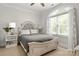 Serene bedroom with a stylish bed and a large window for natural light at 849 Savile Ln, Fort Mill, SC 29715
