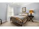 Cozy bedroom with a comfortable bed, soft lighting, and natural light at 849 Savile Ln, Fort Mill, SC 29715