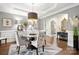 Elegant dining room with stylish chandelier, hardwood floors, and a decorative rug at 849 Savile Ln, Fort Mill, SC 29715