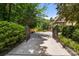 View of the home through the iron gates highlighting the long private driveway leading to the house at 849 Savile Ln, Fort Mill, SC 29715