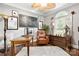 Cozy home office featuring warm lighting, hardwood floors, and a neutral color palette at 849 Savile Ln, Fort Mill, SC 29715