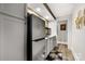 A modern kitchenette includes stainless appliances, crisp white cabinets, and tiled backsplash at 849 Savile Ln, Fort Mill, SC 29715