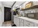 Stylish kitchenette with modern appliances, white countertops, and sleek gray cabinets at 849 Savile Ln, Fort Mill, SC 29715
