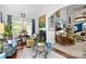 Open-concept living room with fireplace, stylish furniture, and ample natural light at 849 Savile Ln, Fort Mill, SC 29715