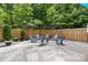 Outdoor space with ample seating surrounded by a wooden fence and lush greenery at 849 Savile Ln, Fort Mill, SC 29715
