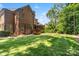 Expansive backyard with lush lawn and a screened-in porch, perfect for outdoor relaxation and entertaining at 9027 Kirkley Ct, Charlotte, NC 28277